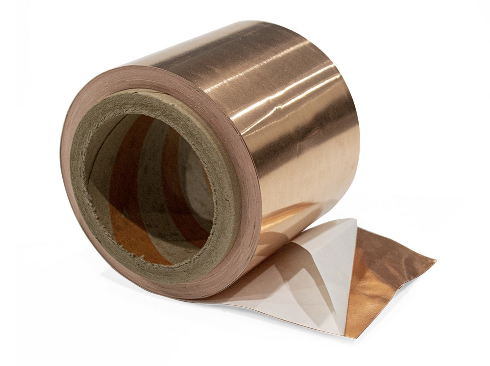 Engineered EMI shielding metal foils and synthetic graphite thermal heat spreaders laminated with conductive adhesive