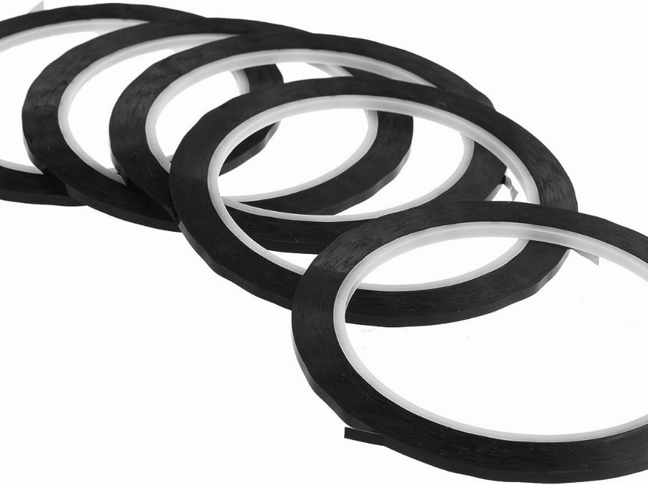 Precision narrow slit tape coils down to 2 mm width wound with controlled tension on plastic cores for electronic assembly