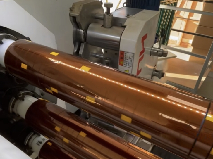 Heavy-duty rotary shear slitting machine cleanly converting thick foam tapes, copper foils, and structural adhesive laminates with burr-free edges